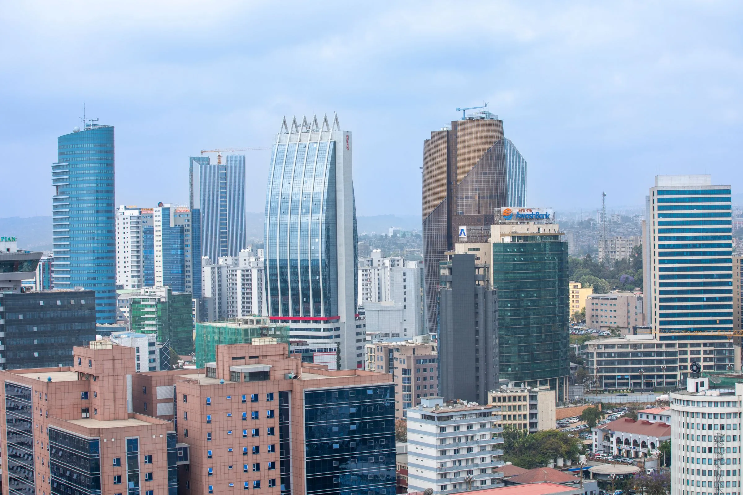 Office towers in central Addis Ababa under a cloudy sky